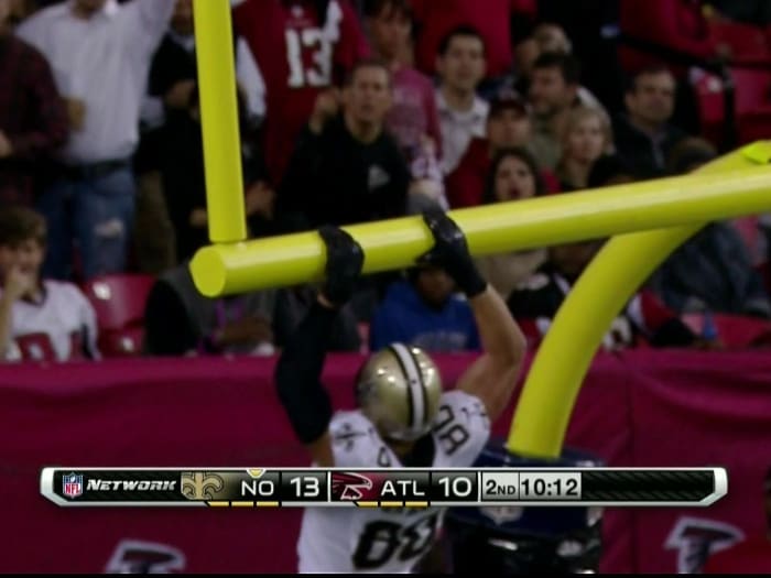 Saints TE Jimmy Graham bends the goal posts after a 2013 touchdown against the Atlanta Falcons. Credit: USA TODAY